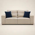 Beige luxury sofa with navy blue velvet cushions, modern design for living room comfort