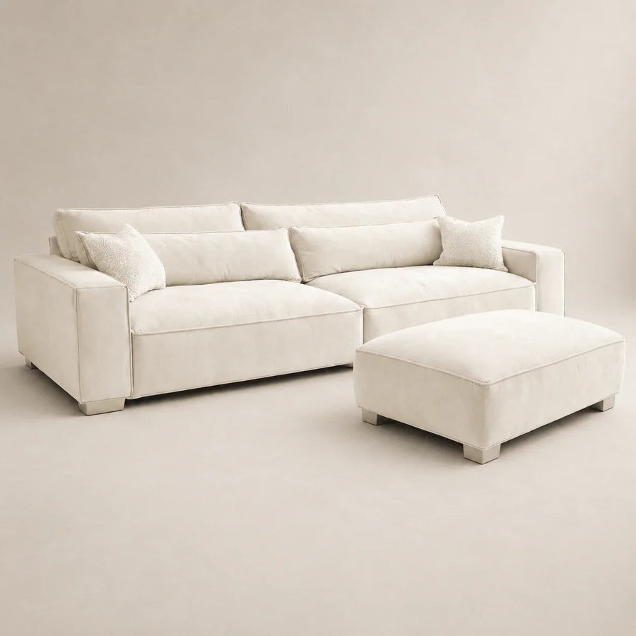 Cream luxury sectional sofa with matching ottoman and decorative pillows, modern living room furniture