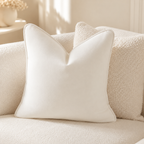 Cream velvet throw pillow on cozy textured sofa, luxury living room decor