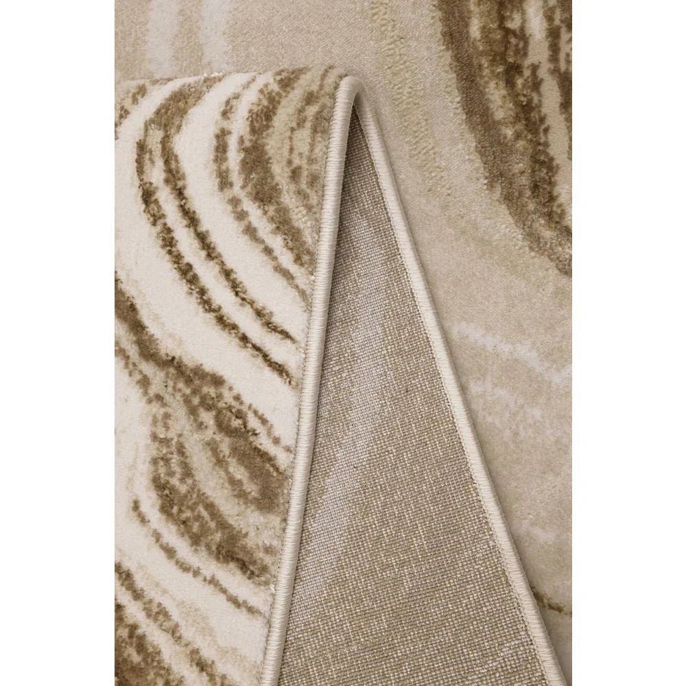 Luxury beige area rug with swirling brown pattern and stitched edge, perfect for modern living rooms.