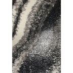 Luxury plush rug with abstract black, gray, and cream pattern for modern living spaces