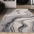 Gray and white abstract wave pattern area rug in modern living room with wooden floors
