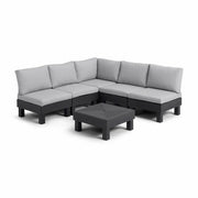 Modular outdoor sectional sofa with gray cushions and black frame, includes matching coffee table