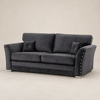 Luxury dark grey velvet sofa with studded arms and matching cushions, ideal for modern living rooms.