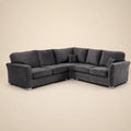 Luxury dark grey corner sofa with studded arms and plush cushions, ideal for modern living rooms.