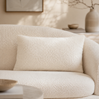Cream bouclé sofa with matching cushion, modern living room decor