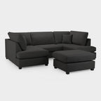 Modern black U-shaped corner sofa with chaise and ottoman on white background