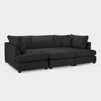 Modern black U-shaped corner sofa with plush cushions on a white background