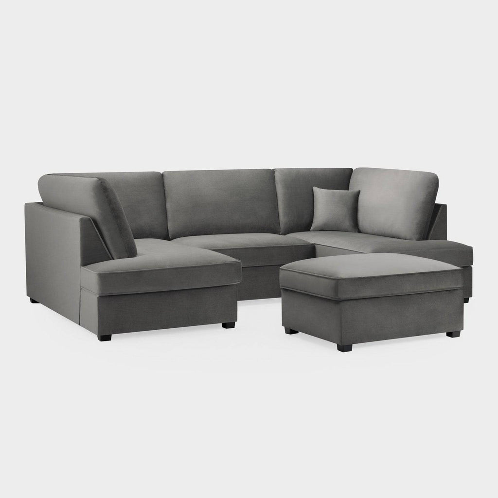 Modern U-shaped grey corner sofa with plush upholstery and matching ottoman on white background.