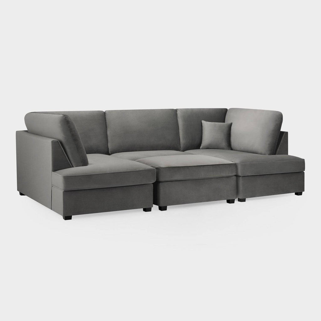 Plush grey U-shaped corner sofa with matching cushion on a white background