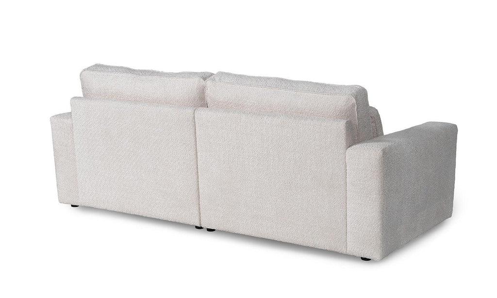 Back view of a modern small boucle two-seater sofa with plush cushions and wide arms
