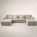 Luxury beige sectional sofa with chaise lounges and plush cushions, ideal for modern living rooms