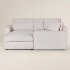Luxury light gray sectional sofa with chaise and plush cushions, modern living room furniture