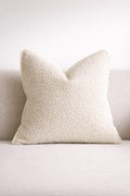 Cream textured throw pillow on neutral sofa, luxury home decor accent