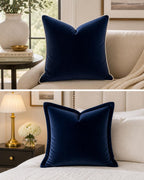 Navy velvet throw pillow with contrast piping, styled on luxury sofa and bed for modern living spaces