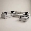 Luxury grey sectional sofa with black and white pillows, perfect for modern living rooms