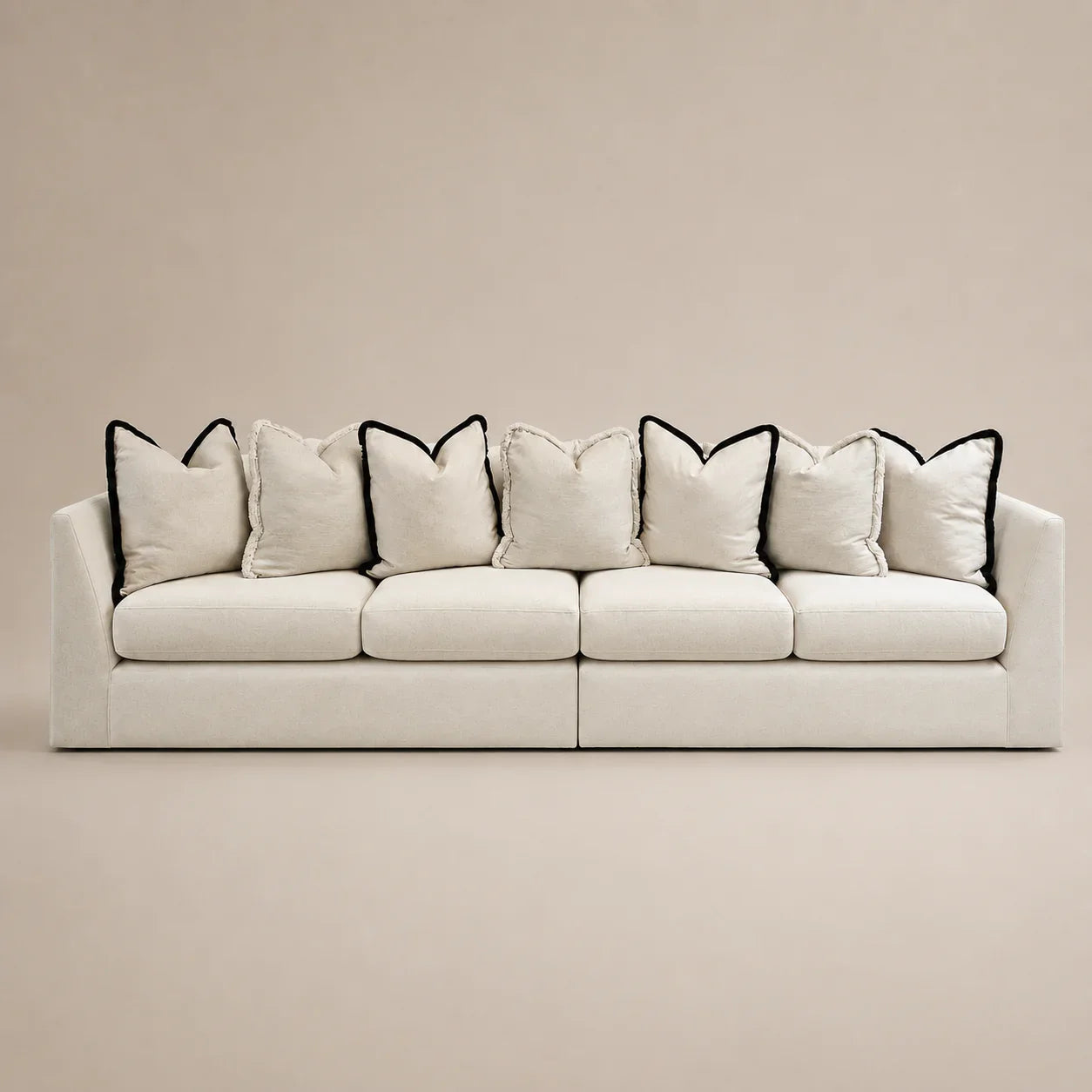 Luxury beige sofa with black-trimmed pillows, modern design for living room comfort