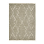 Beige area rug with white geometric lattice pattern and fringe edges, ideal for modern living rooms.