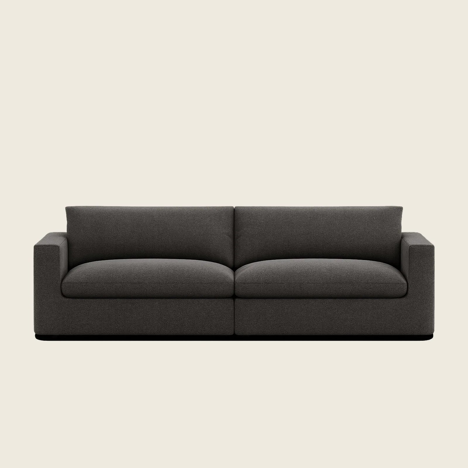 Modern dark grey fabric sofa with clean lines and plush cushions, ideal for luxury living rooms