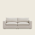 Modern beige fabric sofa with clean lines and plush cushions, ideal for luxury living rooms
