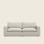 Modern beige fabric sofa with clean lines and plush cushions, ideal for luxury living rooms