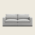 Modern light gray two-seater sofa with clean lines and plush cushions, ideal for luxury living rooms