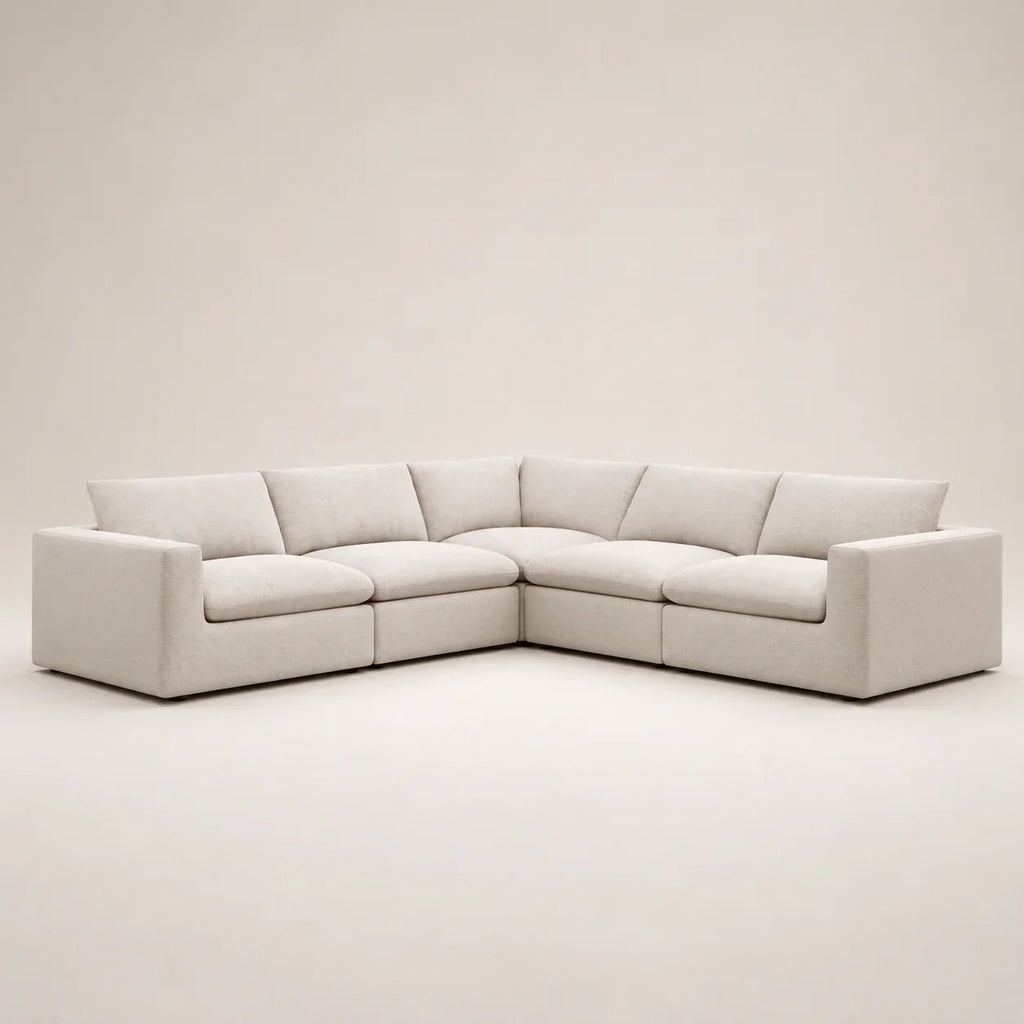 Modern beige sectional sofa with plush cushions, ideal for luxury living rooms