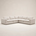 Modern beige sectional sofa with plush cushions, ideal for luxury living rooms