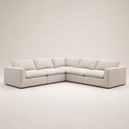 Modern beige sectional sofa with plush cushions, ideal for luxury living rooms
