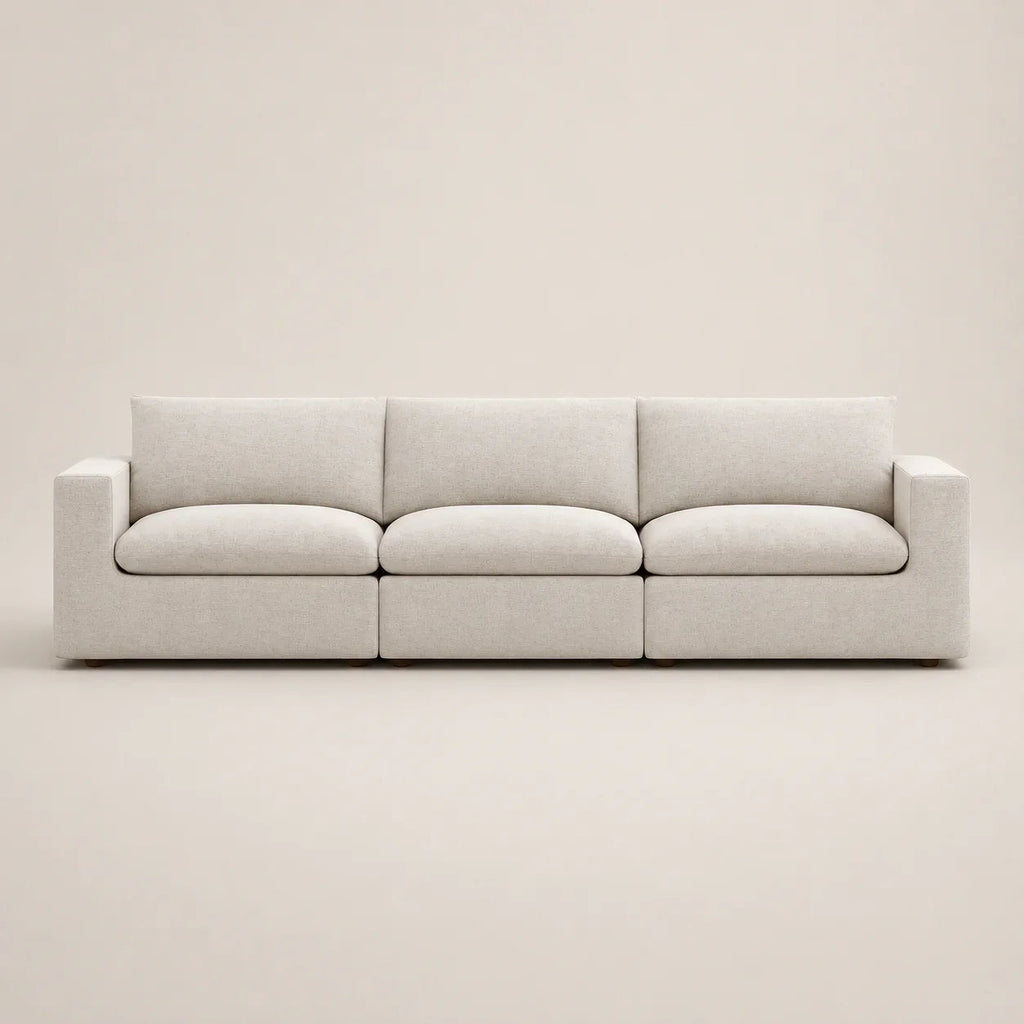 Modern beige 3-seater sofa with clean lines and plush cushions, ideal for luxury living rooms
