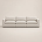 Modern beige 3-seater sofa with clean lines and plush cushions, ideal for luxury living rooms