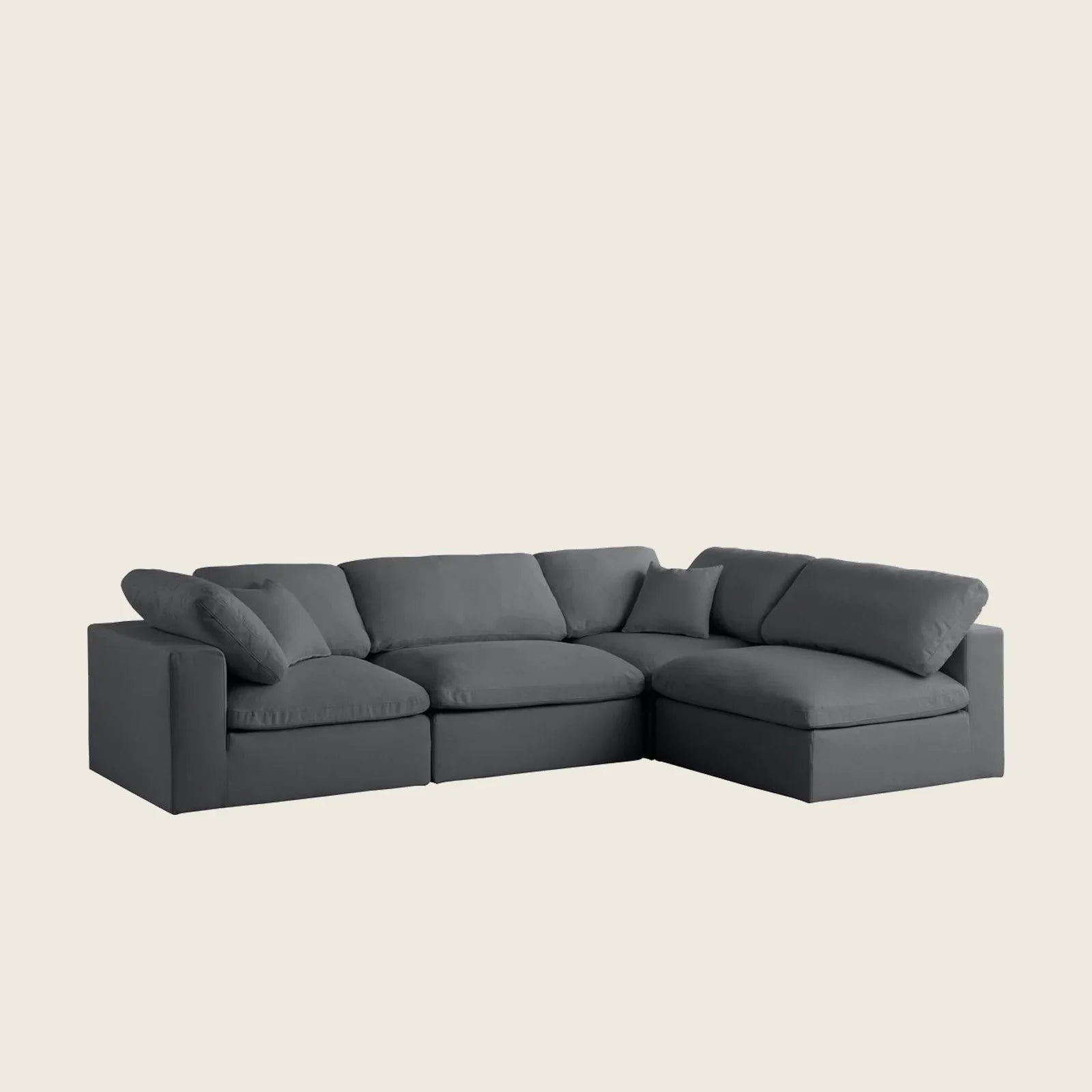 Dark gray L-shaped sectional sofa with plush cushions, ideal for modern living rooms