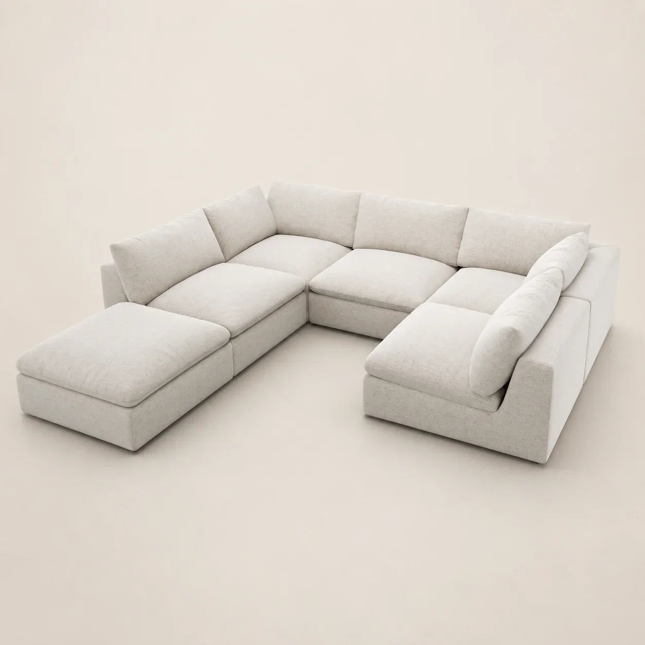 Modern L-shaped sectional sofa with chaise lounges in light neutral fabric, perfect for luxury living rooms
