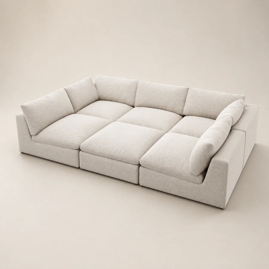 Modern beige sectional sofa with plush cushions, ideal for luxury living room furniture