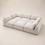 Modern beige sectional sofa with plush cushions, ideal for luxury living room furniture