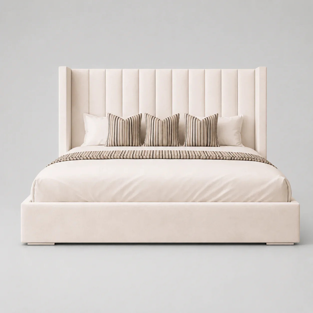 Luxury upholstered bed with tufted headboard, striped pillows, and neutral bedding for modern bedrooms