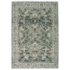 Vintage-style area rug with distressed floral pattern in sage green and charcoal, perfect for living room decor.