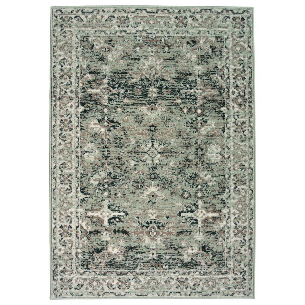 Vintage-style area rug with distressed floral pattern in sage green and charcoal, perfect for living room decor.