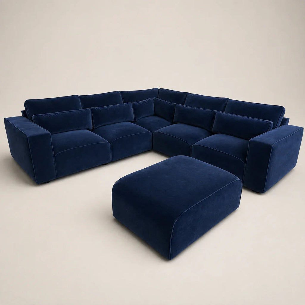 Luxury navy blue velvet sectional sofa with matching ottoman for modern living rooms