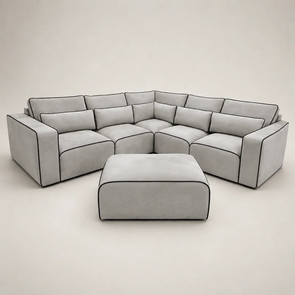 Modern grey sectional sofa with black piping and matching ottoman, luxury living room furniture