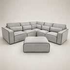Modern grey sectional sofa with black piping and matching ottoman, luxury living room furniture