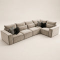 Luxury beige sectional sofa with black and striped throw pillows, modern living room furniture
