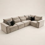 Luxury beige sectional sofa with black and striped throw pillows, modern living room furniture