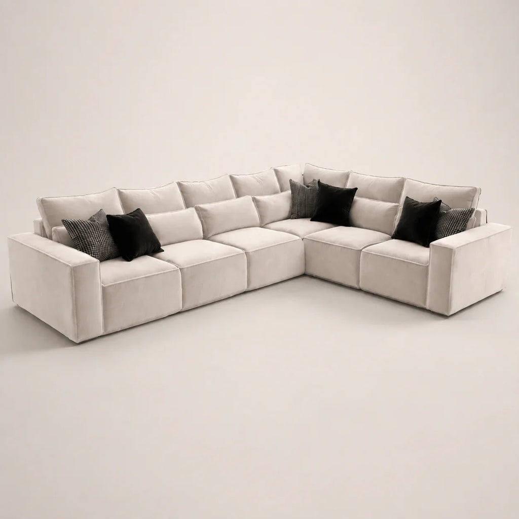Luxury beige sectional sofa with black and patterned throw pillows, modern living room furniture