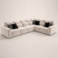 Luxury beige sectional sofa with black and patterned throw pillows, modern living room furniture
