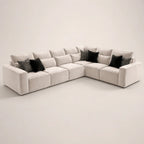 Luxury beige sectional sofa with black and patterned throw pillows, modern living room furniture