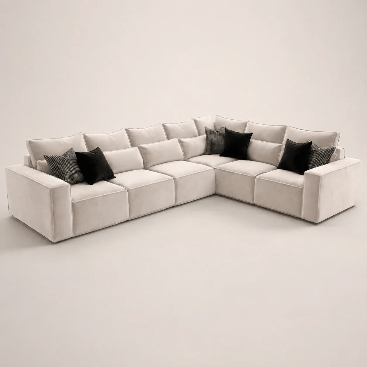 Luxury beige sectional sofa with black and patterned throw pillows, modern living room furniture