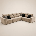 Luxury beige sectional sofa with black and striped throw pillows, modern living room furniture