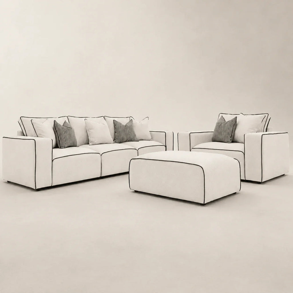 Modern white sectional sofa with black piping, matching armchair and ottoman, luxury living room furniture set