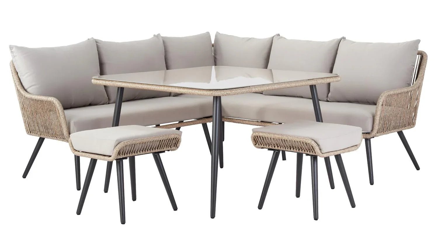 Luxury outdoor wicker sofa set with glass table and matching stools, perfect for patio dining